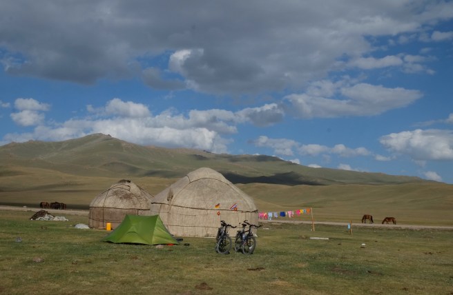 Our little yurt behind its big brothers