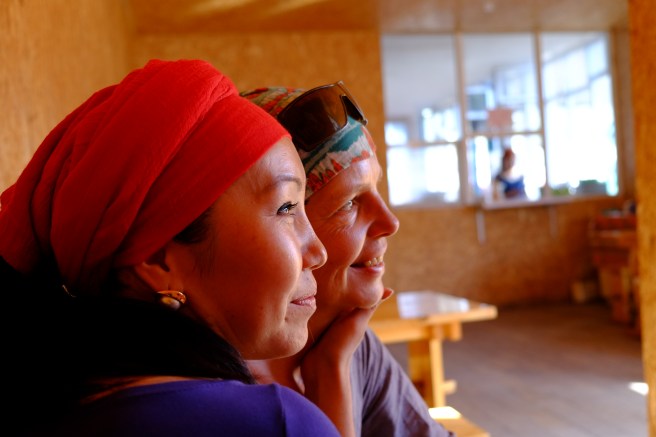 A Kyrgyz waitress in a small cafe being very happy that she could take a picture with me