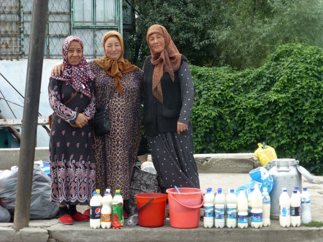 Women selling kumys along the road