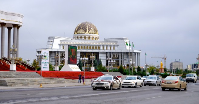 In Turkmenistan everything is big - in the back you see the golden statue of the former president that you can find everywhere in the country